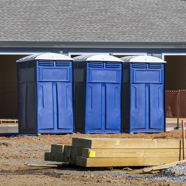 what is the cost difference between standard and deluxe portable restroom rentals in Middlesex